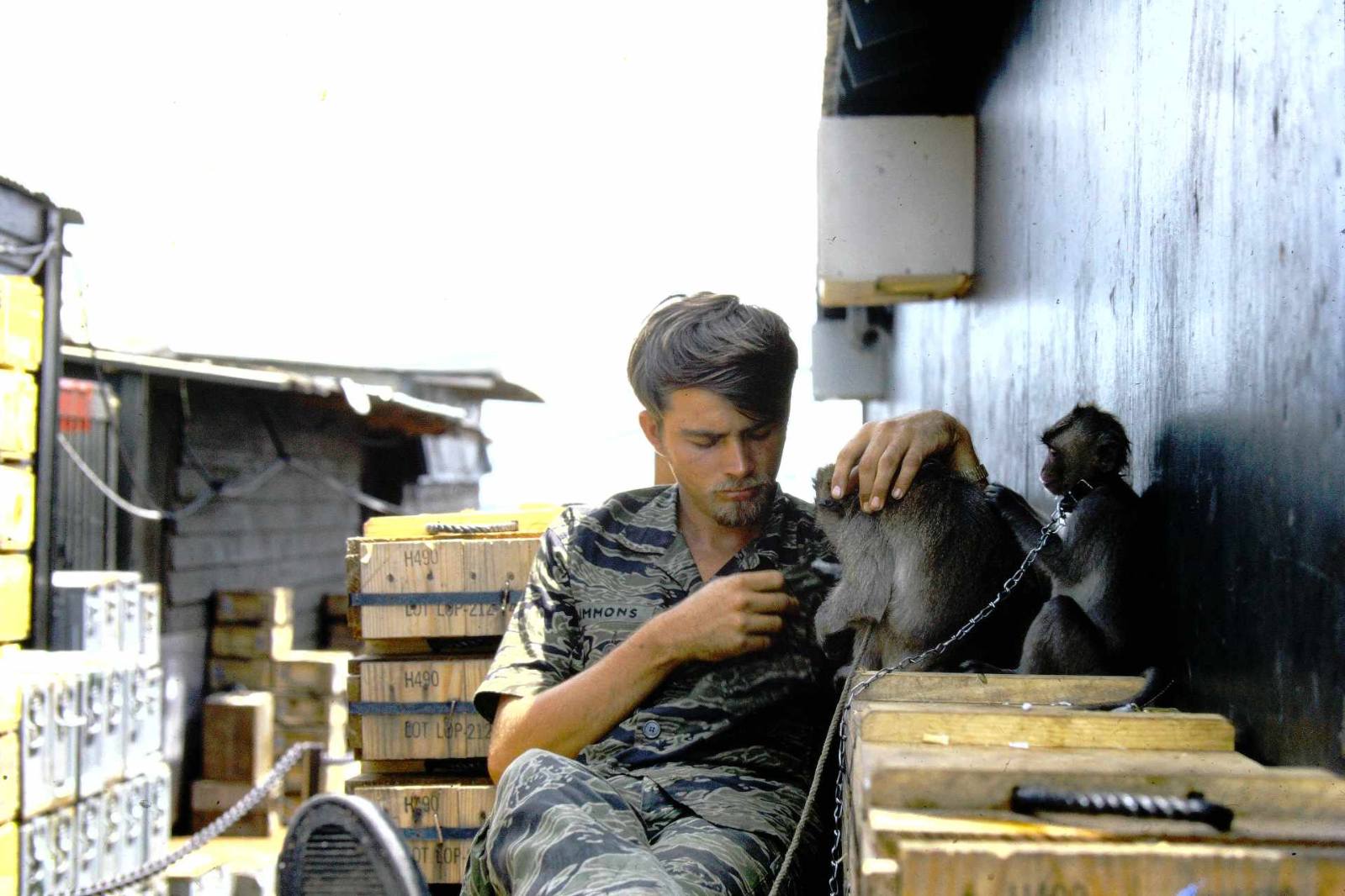 Bill with the detachment's pet monkey